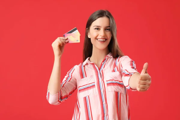 Young Woman Credit Cards Showing Thumb Red Background — Stock Photo, Image