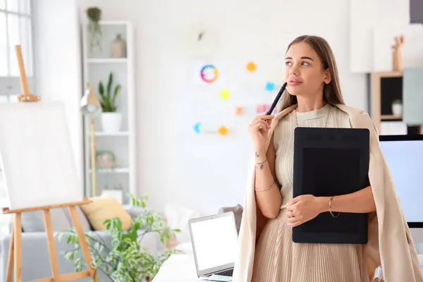 stock image Female interior designer working with graphic tablet in office