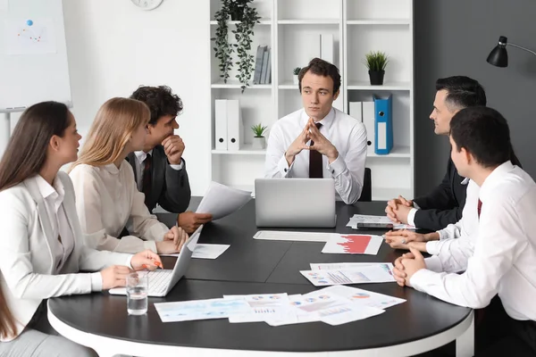 Group of business consultants working in office
