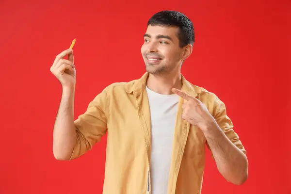 Young Man Pointing French Fries Red Background — Stock Photo, Image