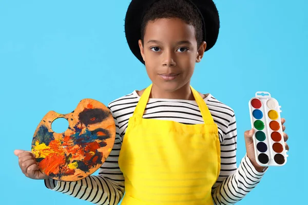Little African American Boy Paints Palette Blue Background — Stock Photo, Image