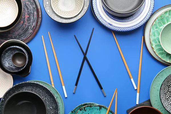 Chinese tableware on blue background