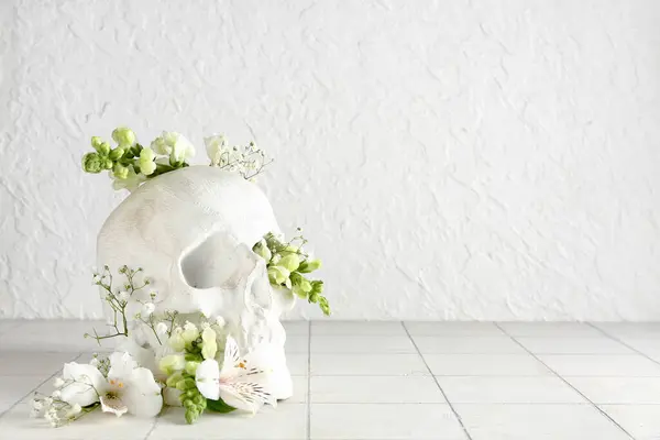 Human Skull Different Beautiful Flowers White Tile Table — Stock Photo, Image