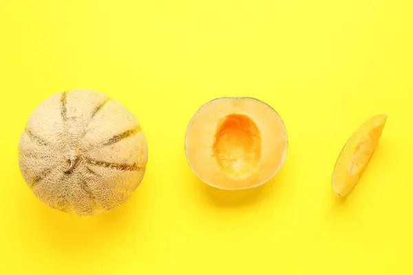 Sweet melons on yellow background