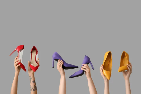 Women Holding Different Stylish High Heels White Background — Stock Photo, Image