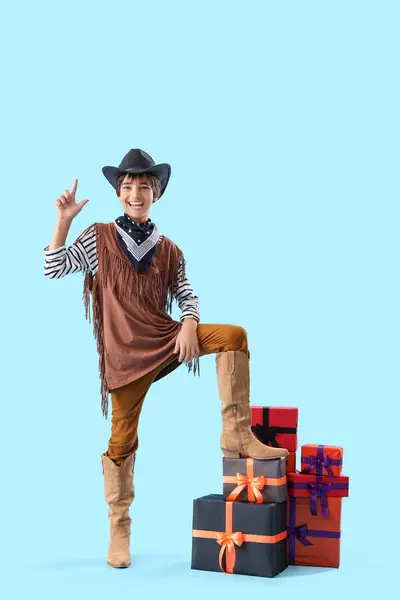 Little Boy Dressed Halloween Cowboy Gifts Pointing Something Blue Background — Stock Photo, Image