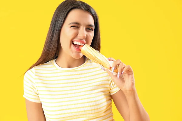 Pretty Young Woman Eating Tasty French Hot Dog Yellow Background — Stock Photo, Image
