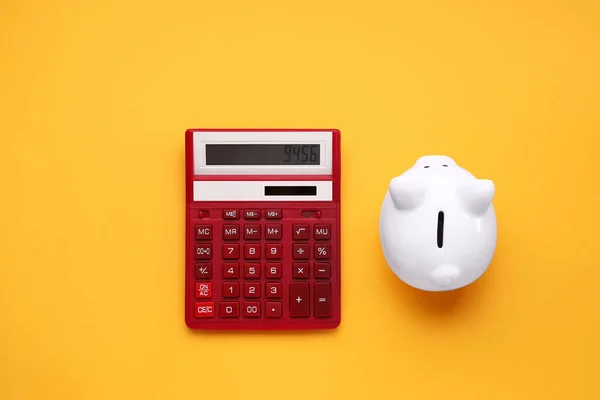 Red Calculator Piggy Bank Orange Background — Stock Photo, Image