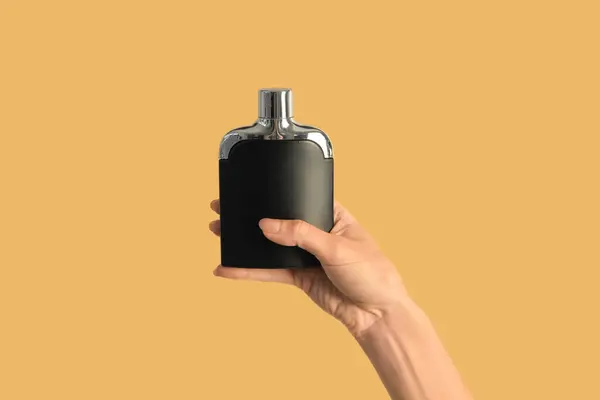 Female Hand Black Bottle Luxury Perfume Beige Background — Stock Photo, Image
