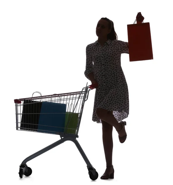 Silhouet Van Jonge Vrouw Met Winkelwagentje Tassen Witte Achtergrond — Stockfoto