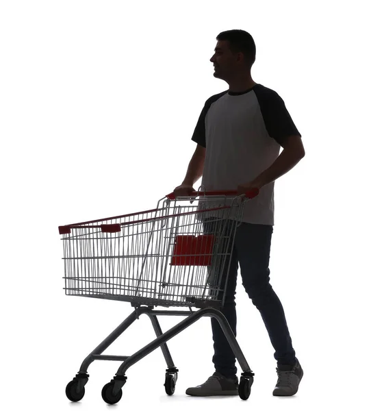 Silhouette Eines Jungen Mannes Mit Leerem Einkaufswagen Auf Weißem Hintergrund — Stockfoto