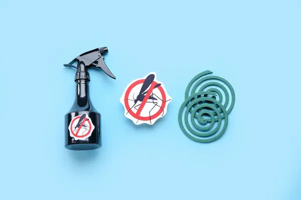 Mosquito repellent spray, spirals and anti insect sign on blue background