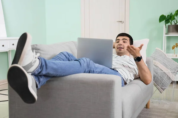 Young Man Laptop Video Chatting Sofa Home — Stock Photo, Image