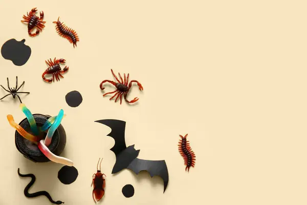 Halloween Composition Candy Bugs Bat Cauldron Beige Background — Stock Photo, Image