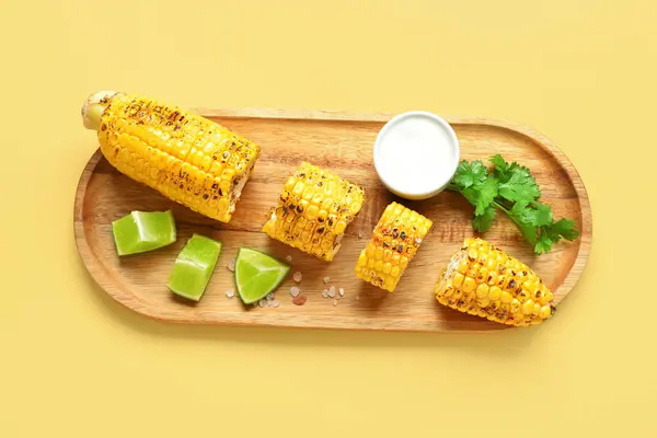 Wooden Board Cut Tasty Grilled Corn Cob Sauce Yellow Background — Stock Photo, Image