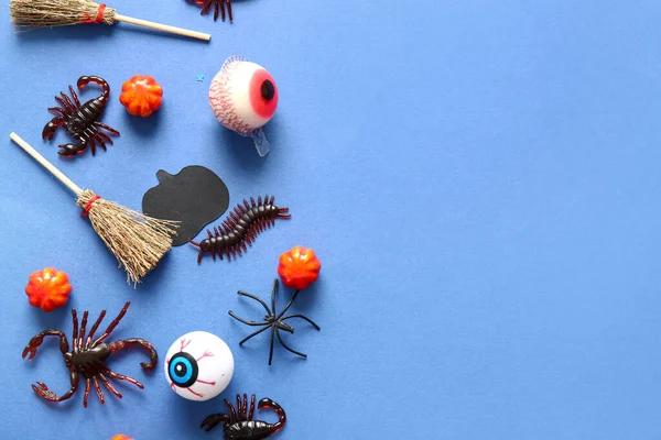 Halloween Composition Candy Bugs Eyeballs Broom Blue Background — Stock Photo, Image