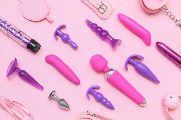 Różne Zabawki Seksualne Różowym Tle — Zdjęcie stockowe