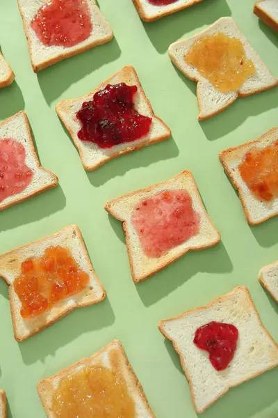 Many Toasts Different Jams Green Background Closeup — Stock Photo, Image