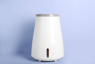 Modern humidifier on grey background
