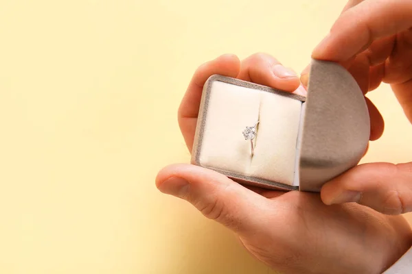 Man Holding Box Engagement Ring Beige Background Closeup — Stock Photo, Image
