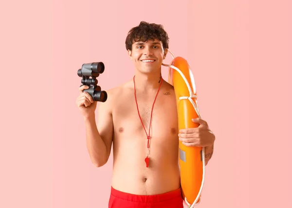 Male Lifeguard Binoculars Ring Buoy Pink Background — Stock Photo, Image