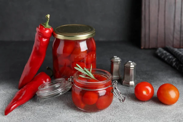 Jars Pickled Tomatoes Rosemary Chili Pepper Grunge Background — Stock Photo, Image