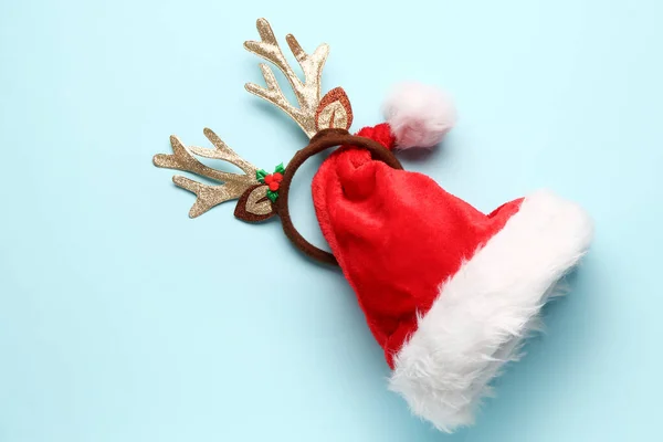 Santa Hat Christmas Reindeer Horns Blue Background — Stock Photo, Image