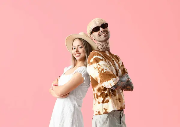 stock image Young couple in summer clothes on pink background