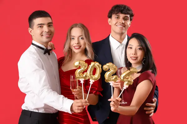 Group Young People Champagne Figure 2024 Red Background — Stock Photo, Image
