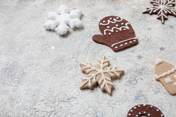 Composition with different Christmas cookies and decorations on grunge background