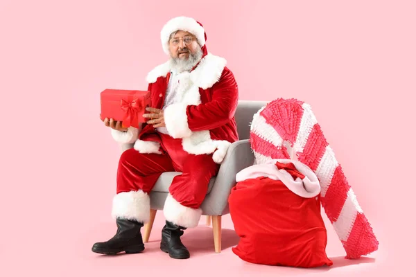 Santa Claus Christmas Present Sitting Armchair Pink Background — Stock Photo, Image