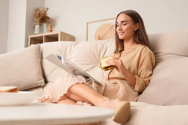 Beautiful Young Woman Tasty Sandwich Reading Magazine While Resting Sofa — Stock Photo, Image