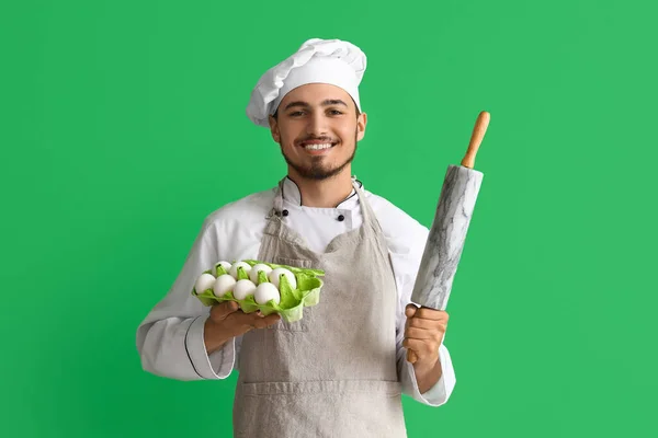 Male Chef Eggs Rolling Pin Green Background — Stock Photo, Image