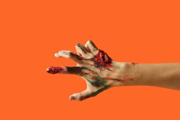 Zombie Ręka Pomarańczowym Tle Święto Halloween — Zdjęcie stockowe