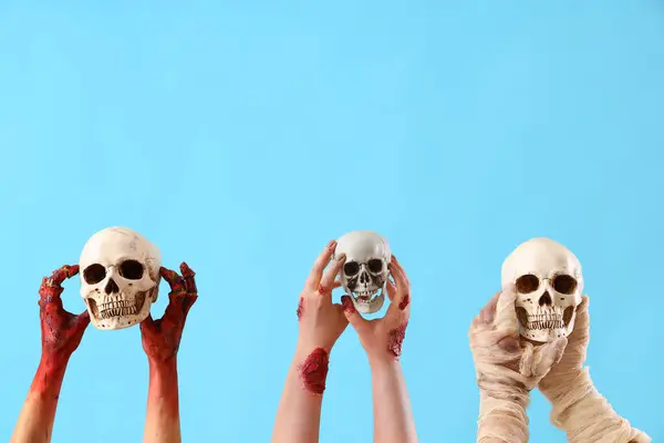 Zombie Mummy Hands Holding Skulls Blue Background Halloween Celebration — Stock Photo, Image
