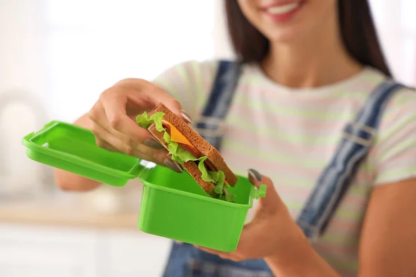 Young Woman Putting Sandwich School Lunchbox Home — Stock Photo, Image
