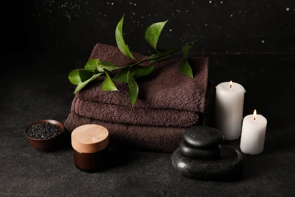 Set of spa supplies on black background