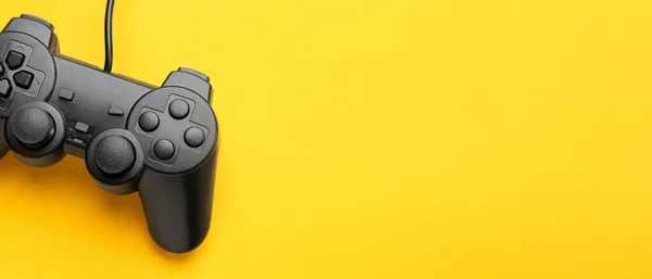 Modern controller on yellow background with space for text