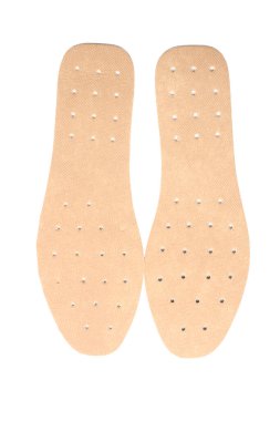 Beyaz arkaplanda bir çift ortopedik taban