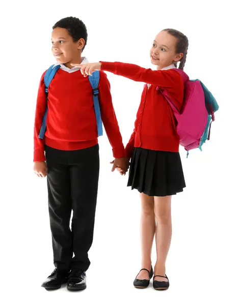 Little Classmates Stylish Uniform Backpacks Pointing Something White Background Royalty Free Stock Images