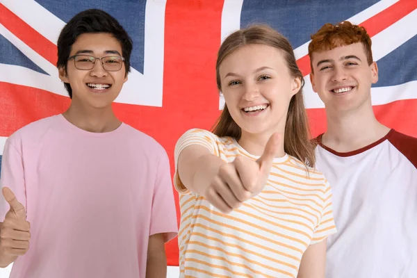 Young students of language school against UK flag