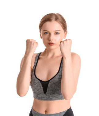 Beyaz arka planda eğitim gören genç bir kadın. Nefsi müdafa kavramı