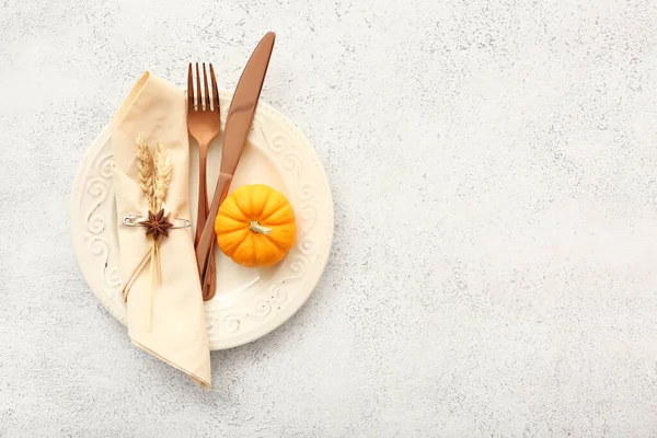 Autumn table setting with pumpkin on white background