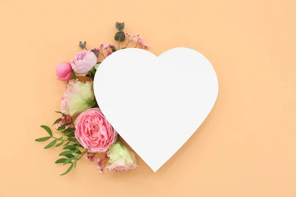 Paper heart with flowers on beige background. National Sweetest Day