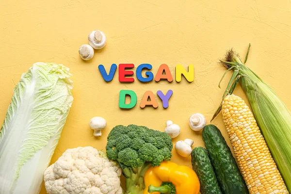 Text Vegan Day Different Fresh Vegetables Yellow Background — Stock Photo, Image