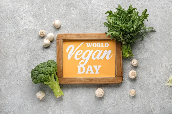 Board Text Vegan Day Different Fresh Vegetables Grey Background — Stock Photo, Image