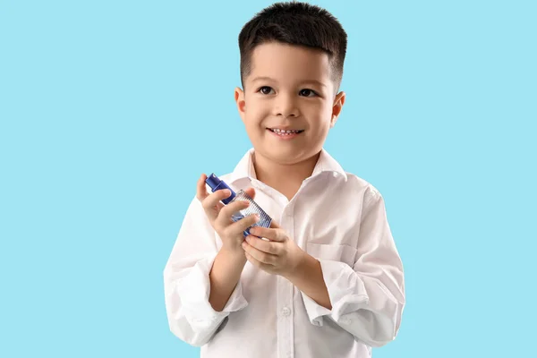 Little Asian Boy Perfume Blue Background — Stock Photo, Image
