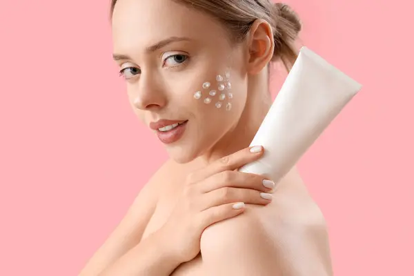 Pretty Young Woman Cream Her Face Pink Background — Stock Photo, Image