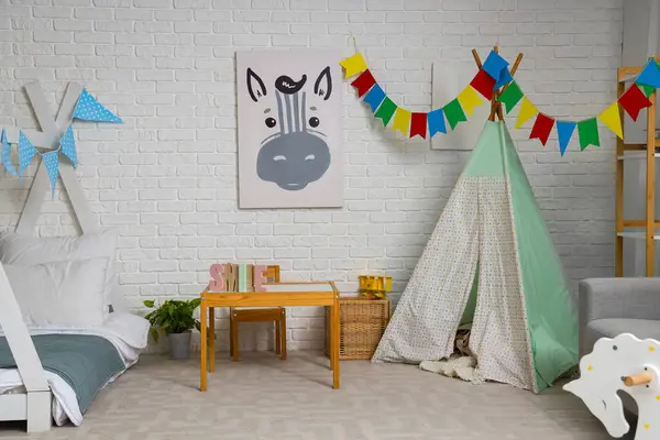 Interior of children\'s room with play tent and bed
