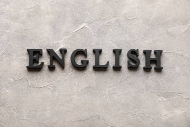 Grunge gri arkaplan üzerinde kelime ENGLISH